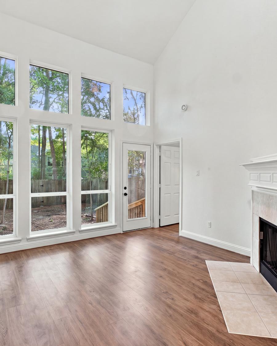 Vaulted living room with floor-to-ceiling windows