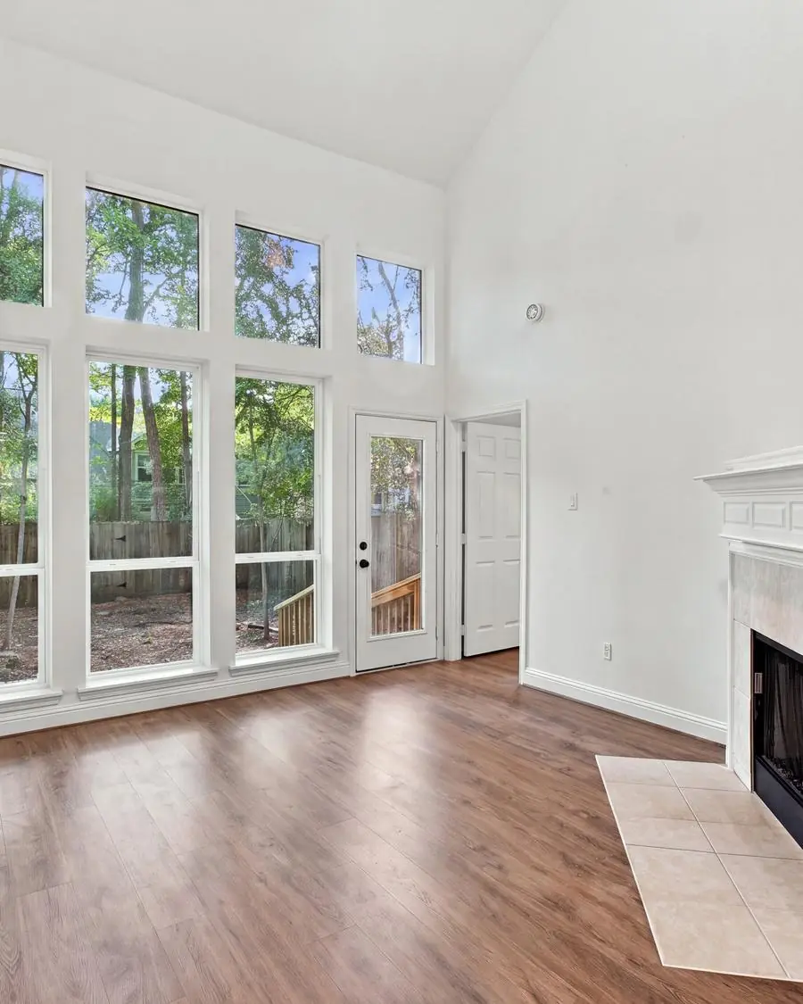 Vaulted living room with floor-to-ceiling windows